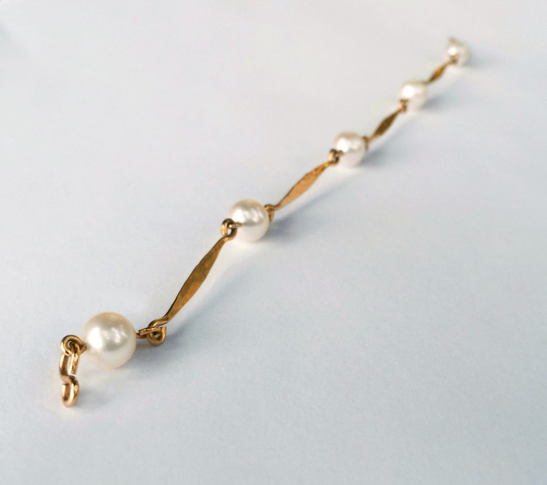 14K yellow gold with five pearls